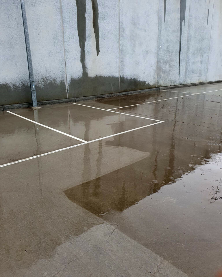Car park showing concrete pressure cleaned by AAA Brick Cleaning